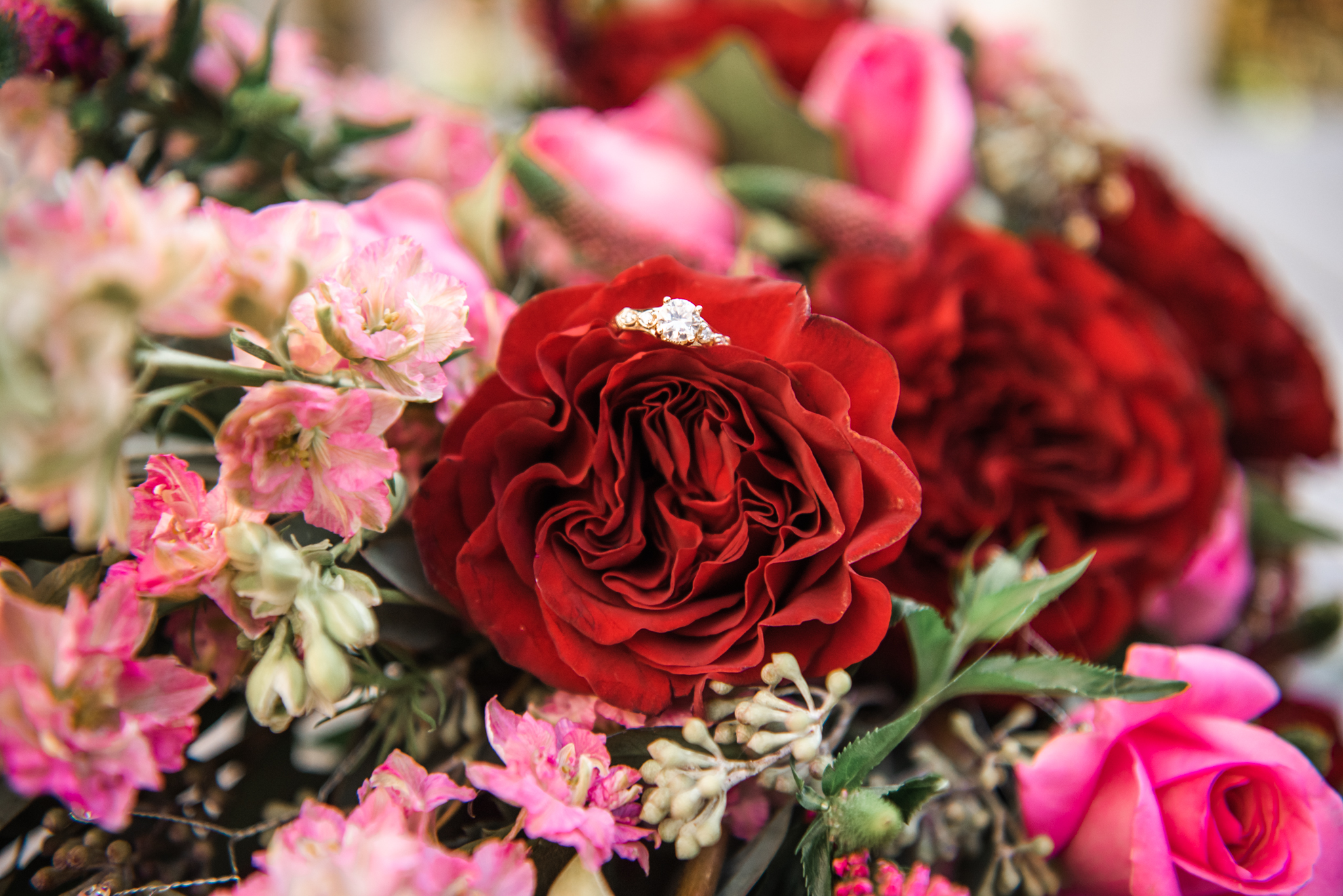 close up of wedding bouquet with ring